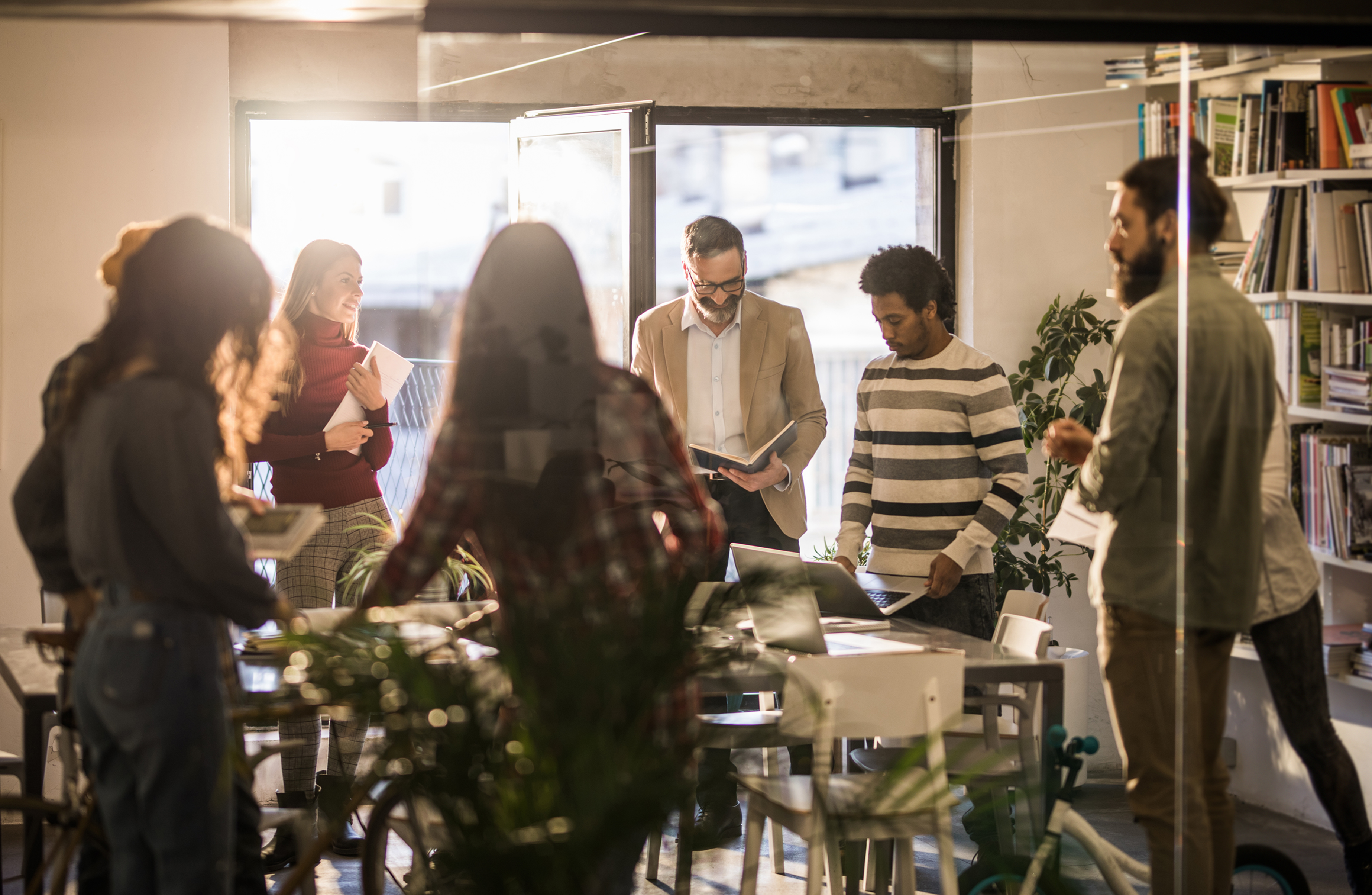 Cross-functional project team collaborating around a visual plan